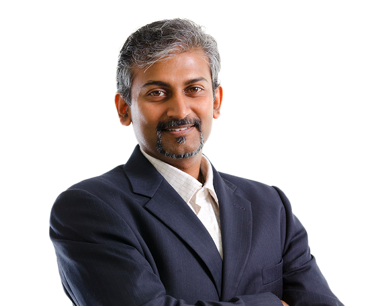 Man in suit standing with arms crossed.